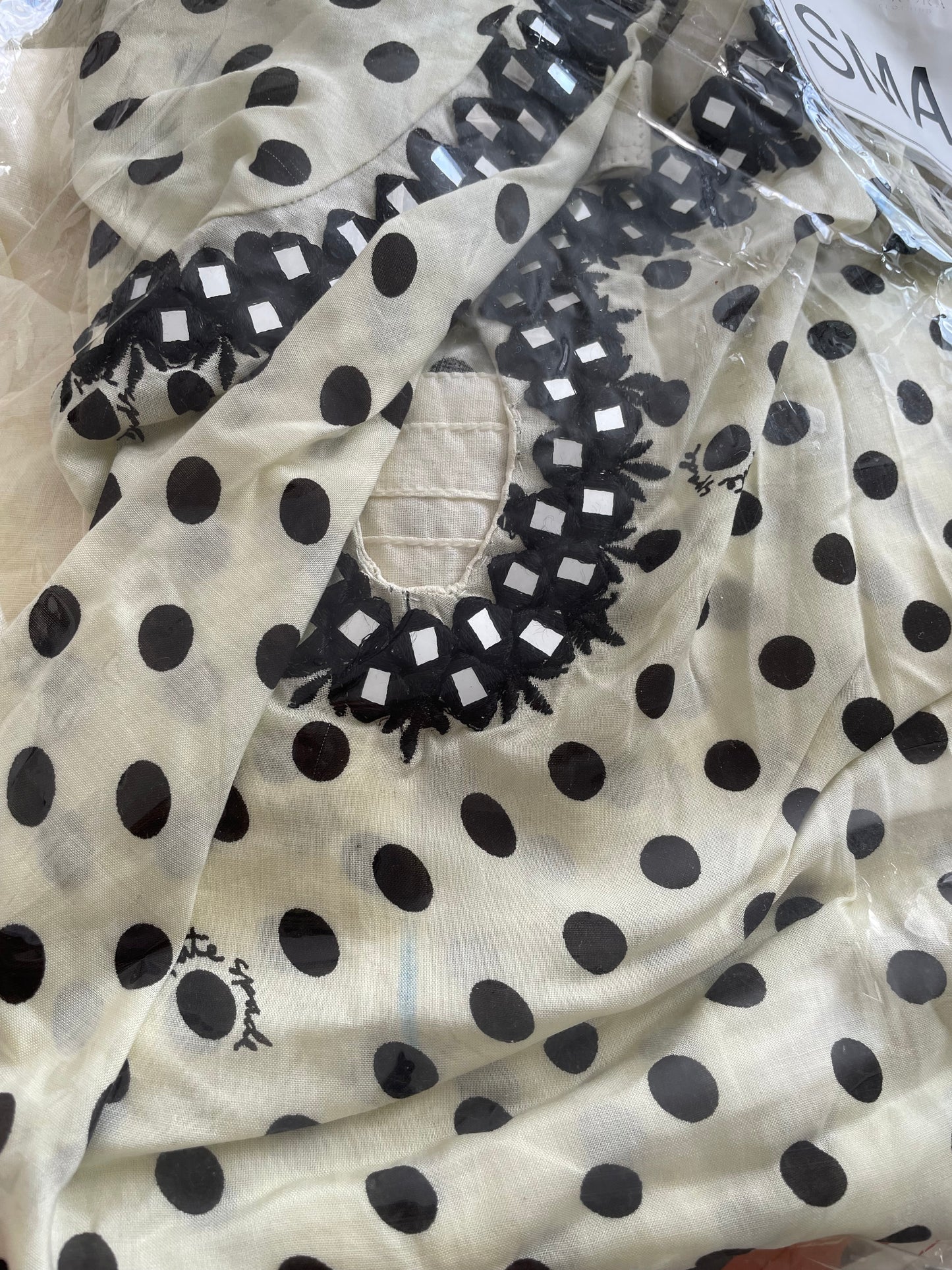 Cream and black polka dot